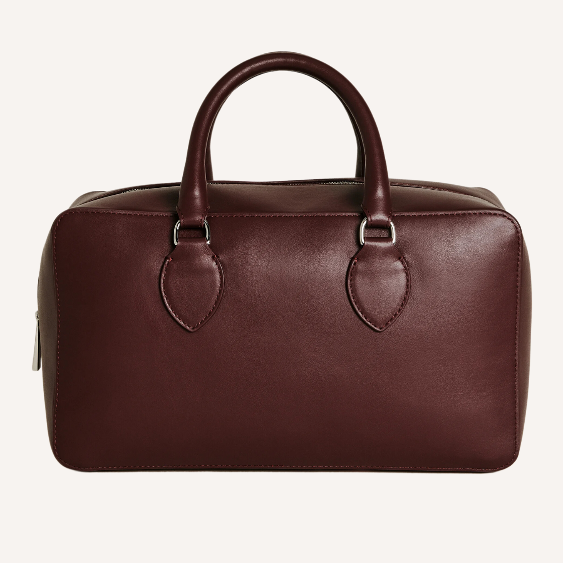 As the crisp air of fall settles in, nothing completes a seasonal wardrobe like chic burgundy bags.