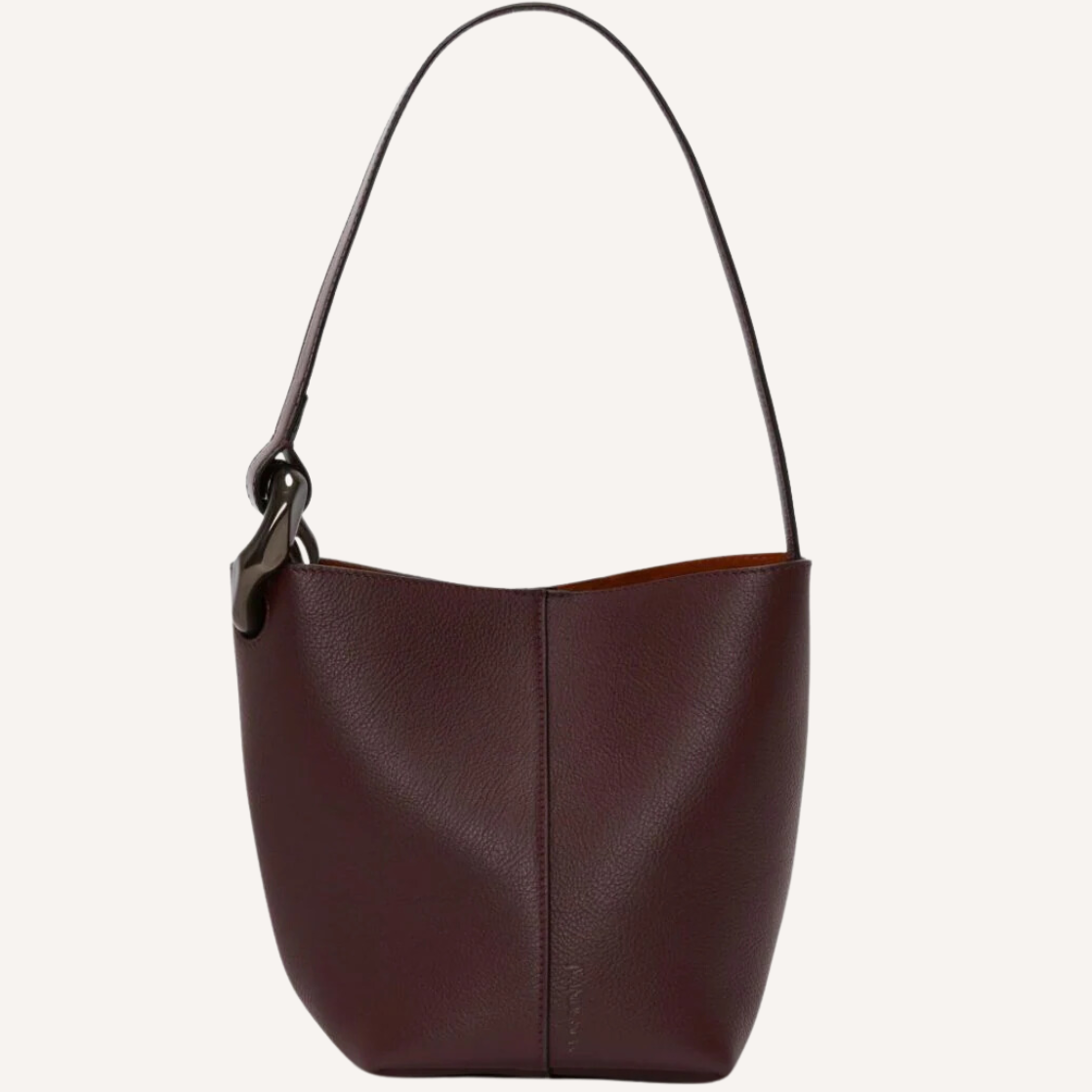 As the crisp air of fall settles in, nothing completes a seasonal wardrobe like chic burgundy bags.