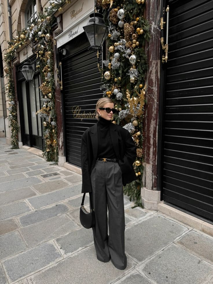 black turtleneck outfit with grey pants and black coat