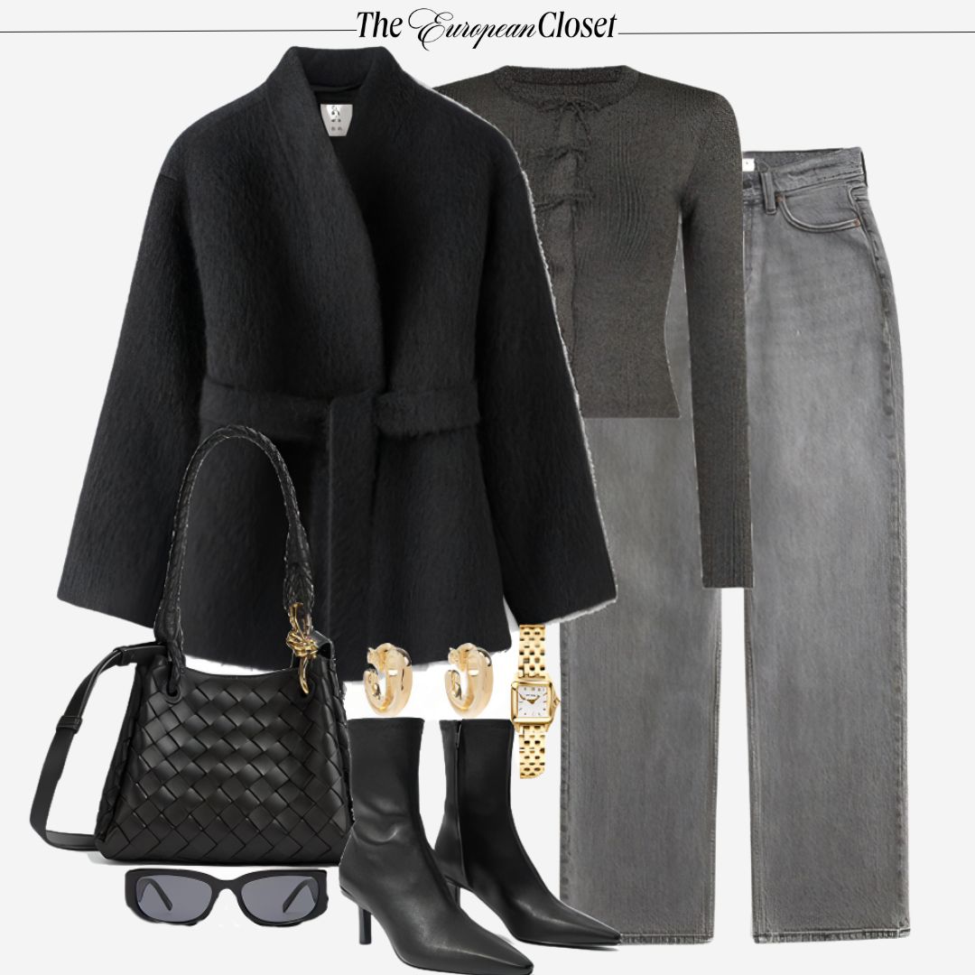 Flat lay of a black wool wrap coat with a tie belt, a gray ribbed sweater, and gray wide-leg jeans, accessorized with black pointed-toe ankle boots, a black woven bag with gold hardware, sunglasses, gold hoop earrings, and a gold watch.