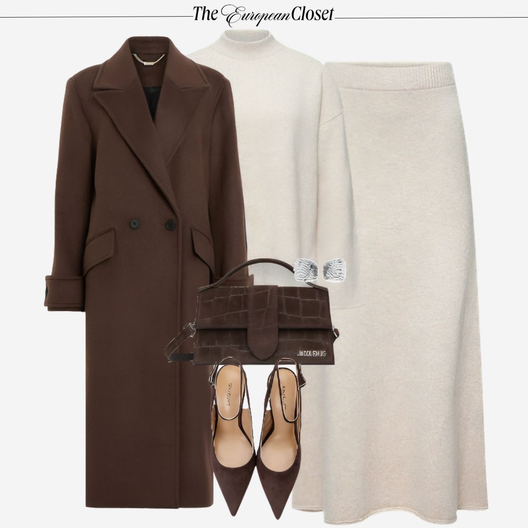 Flat lay of a brown coat, cream turtleneck sweater, cream knit skirt, brown heels, a brown handbag, and silver earrings, styled on a light background.